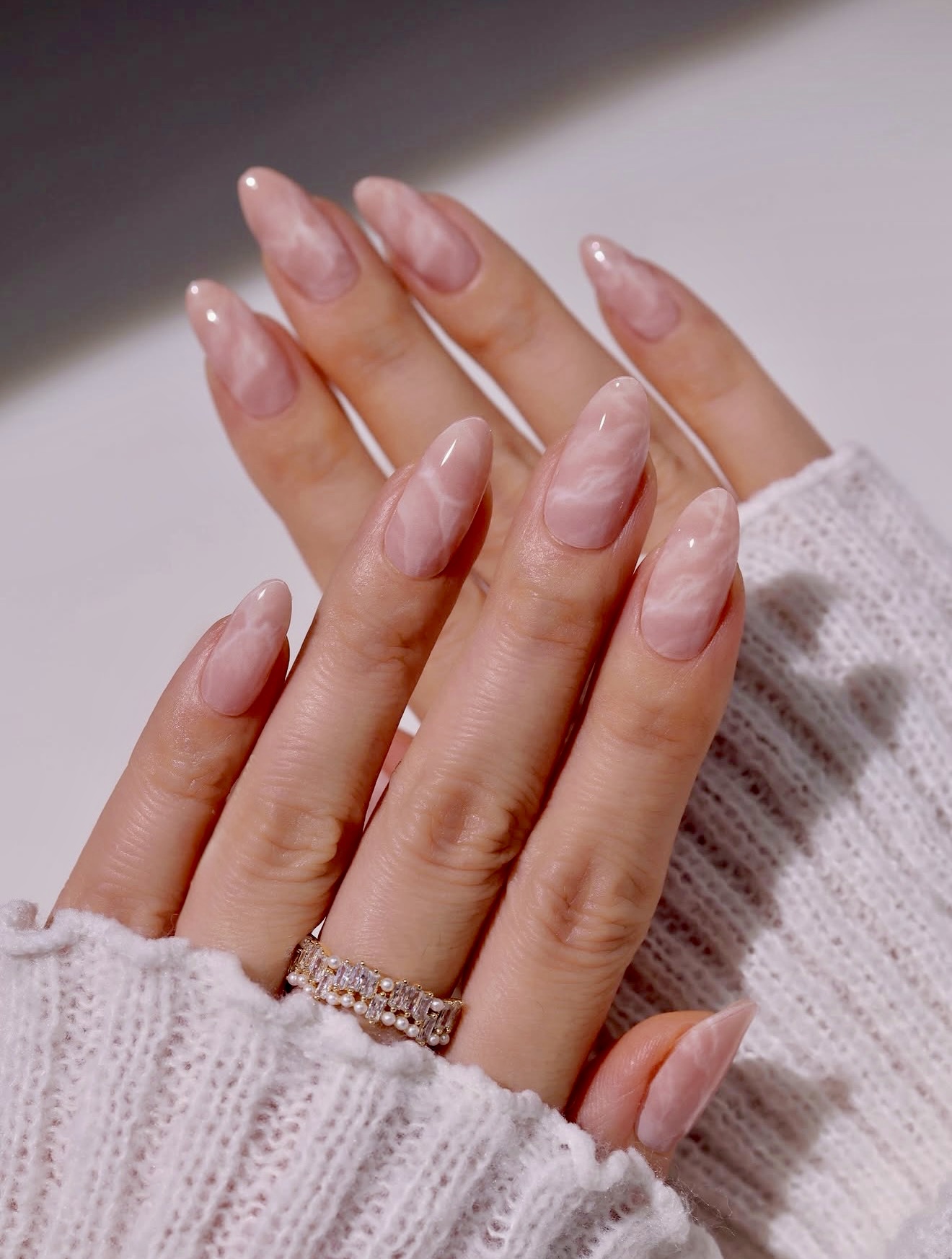 Blush Marble Almond Nails with Glossy Finish