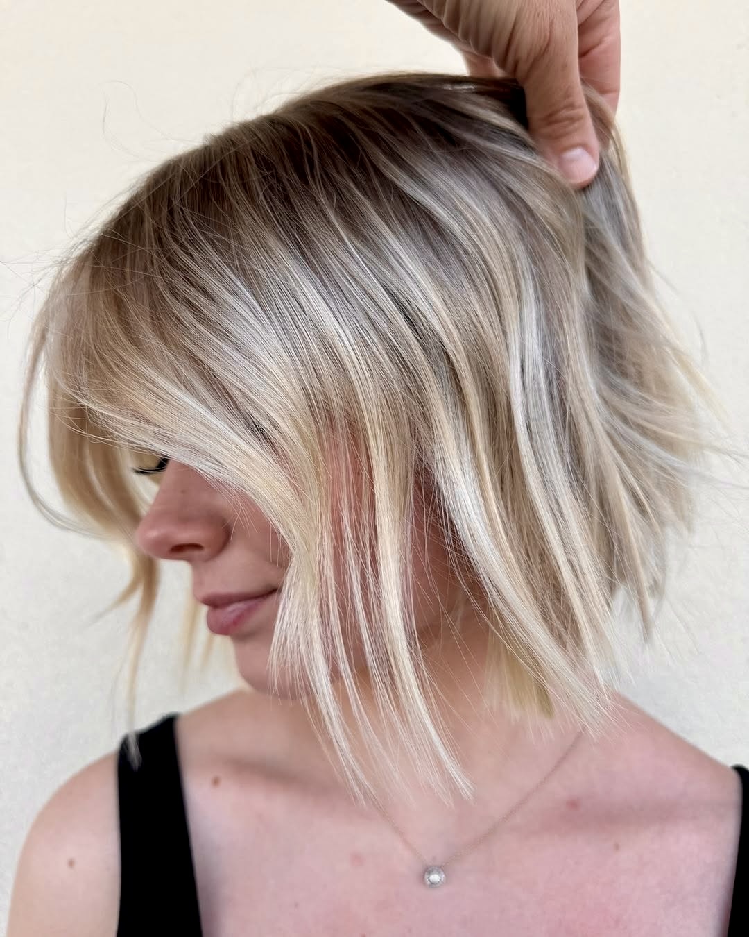 Choppy Platinum Bob With Blended Shadow Root