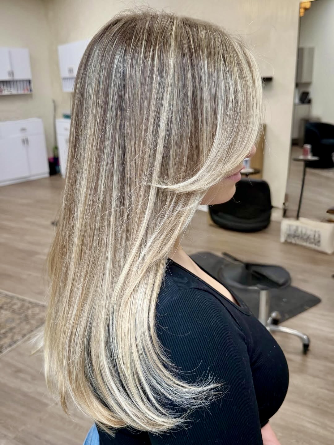 Dimensional Blonde Layers With Face-Framing Curtain Bangs