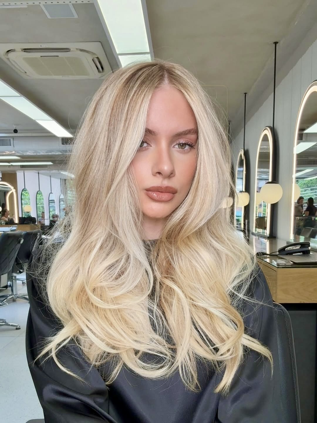 Dimensional Platinum Blonde With Soft Face Framing Layers