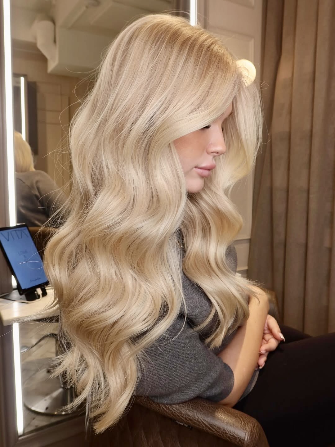 Glamorous Wavy Platinum Blonde Layers With Volume