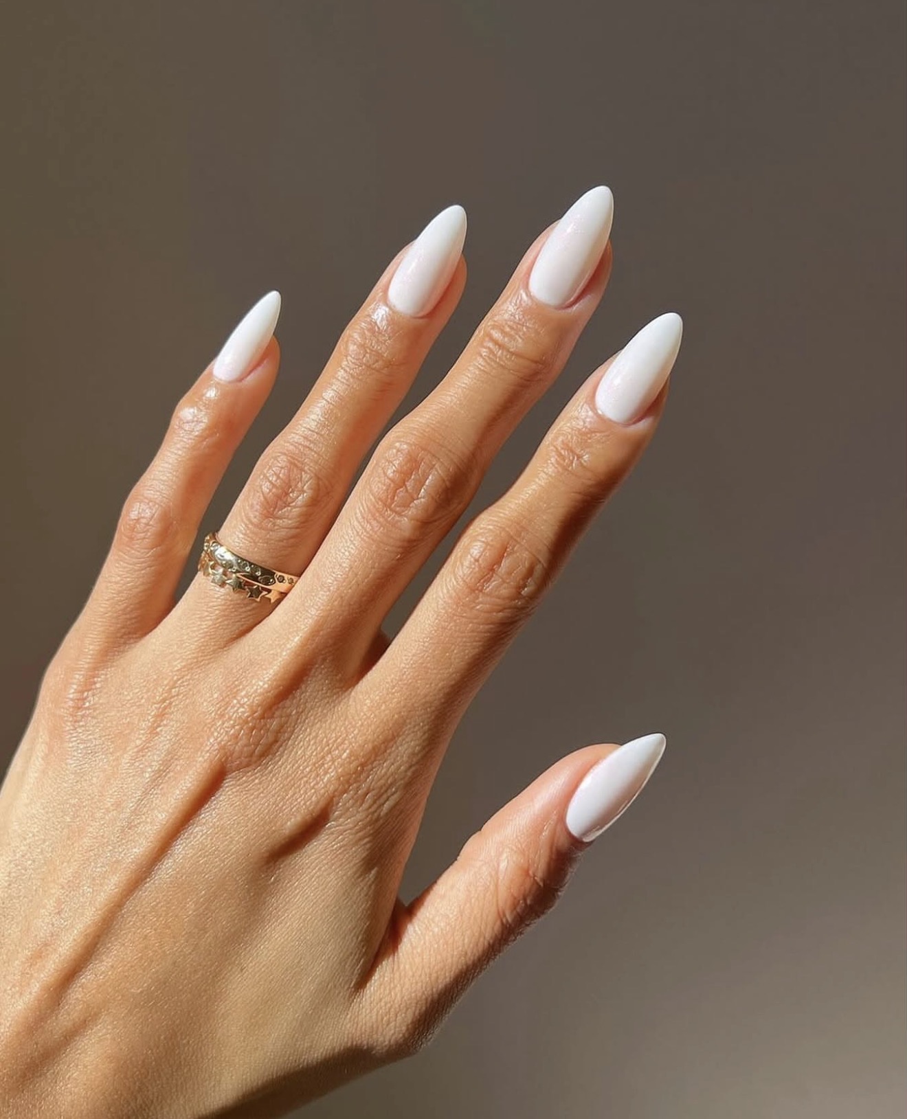 Glossy White Almond Stiletto Nails