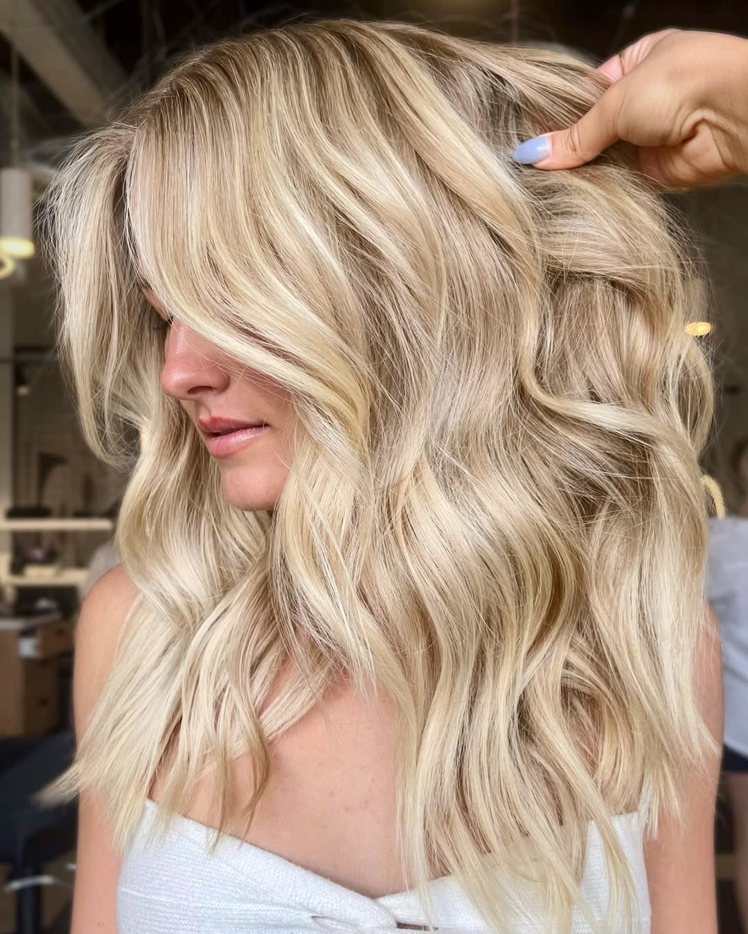 Golden Blonde Waves With Soft Face-Framing Layers