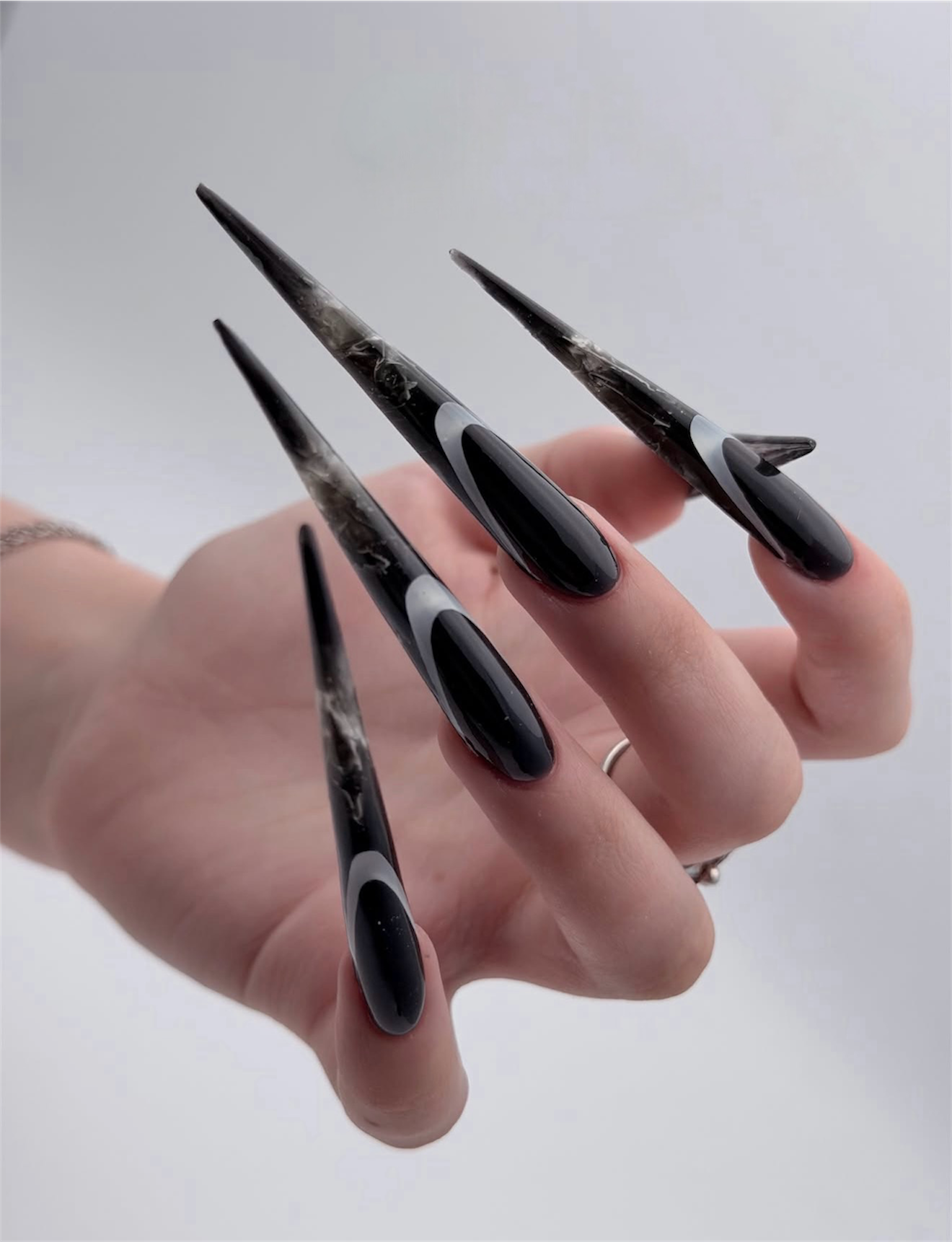 Gothic Marble Stiletto Nails with French Swirls