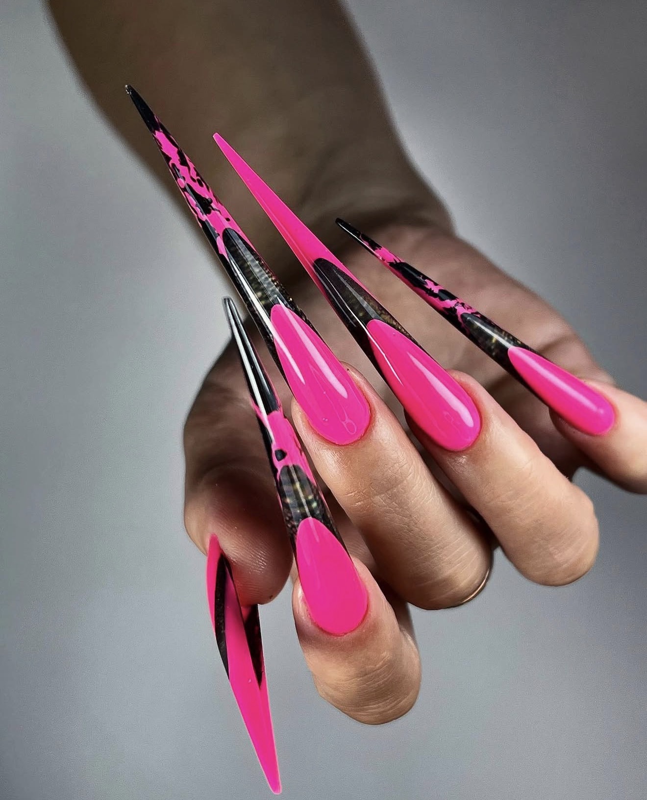 Hot Pink Stiletto Nails with Black Marble Accent