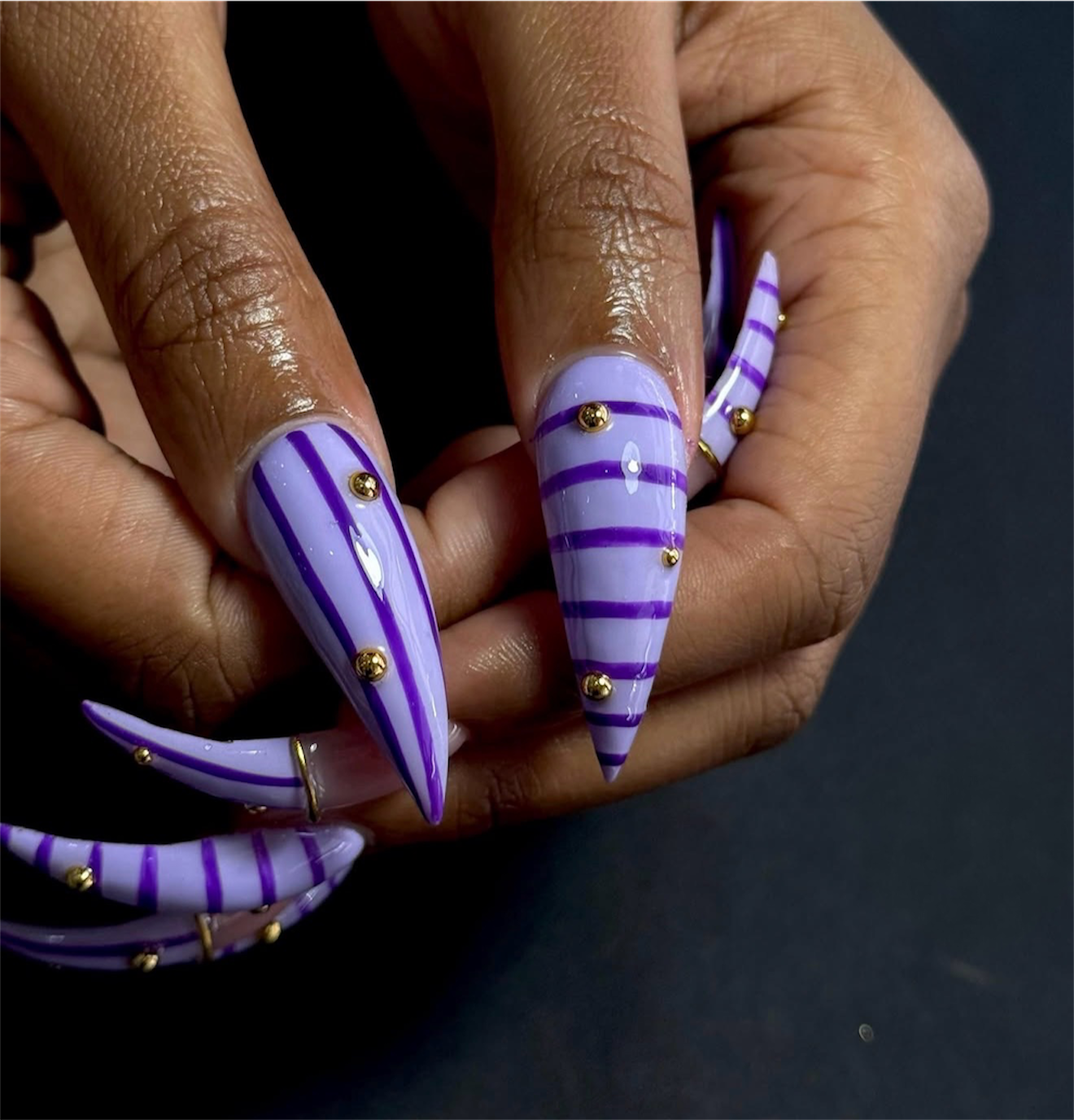 Lavender and Purple Stripe Stiletto Nails