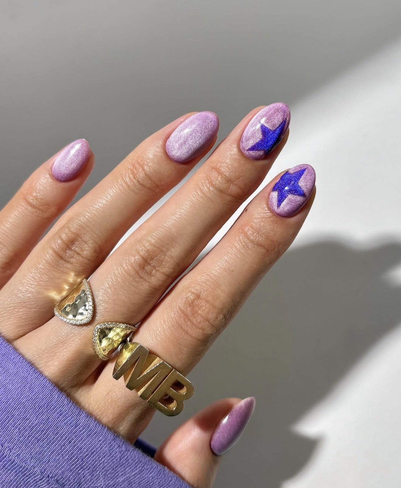Lilac Cat Eye Nails With Electric Blue Stars