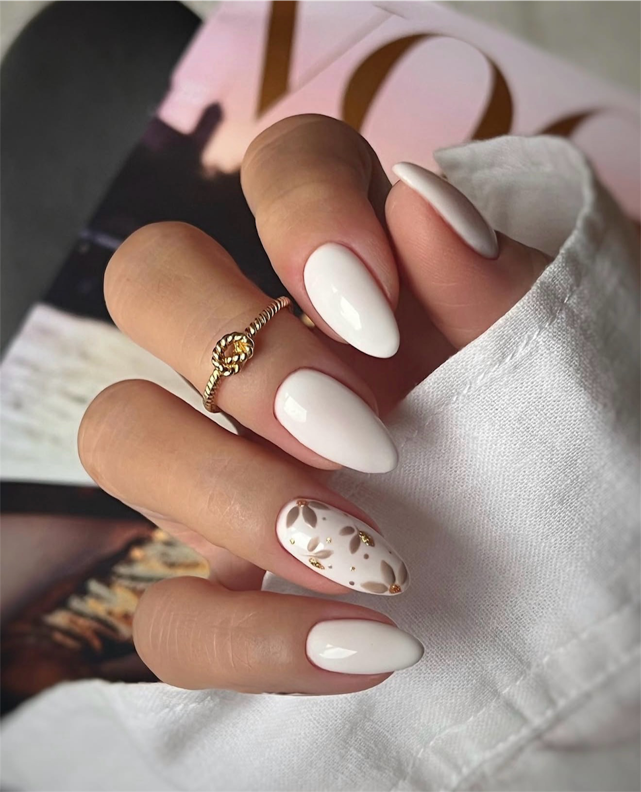 Milky White Almond Nails with Floral Gold Accent