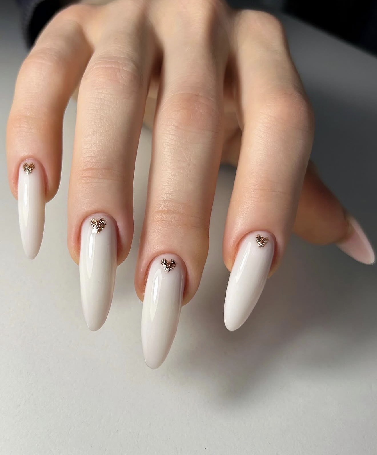 Milky White Almond Nails with Gold Heart Charm
