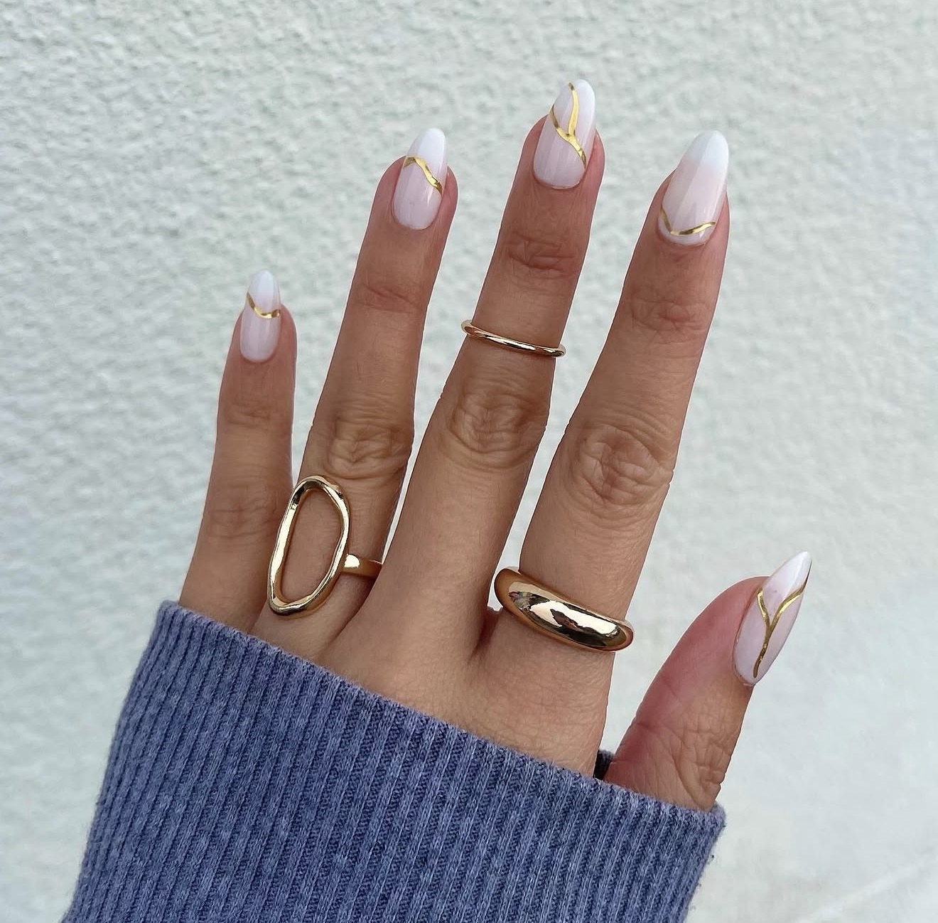 Milky White Almond Nails with Gold Swirl Art