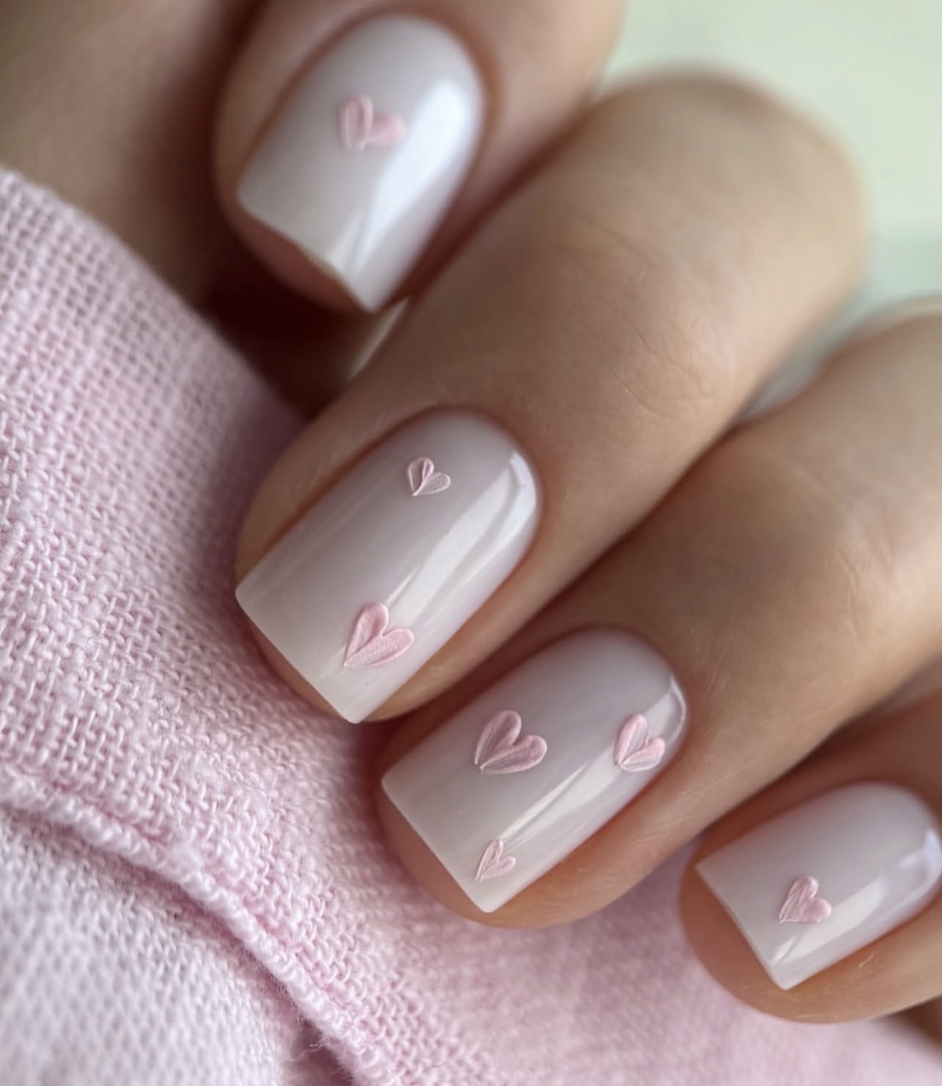 Milky White Nails with Subtle Pink Heart Art
