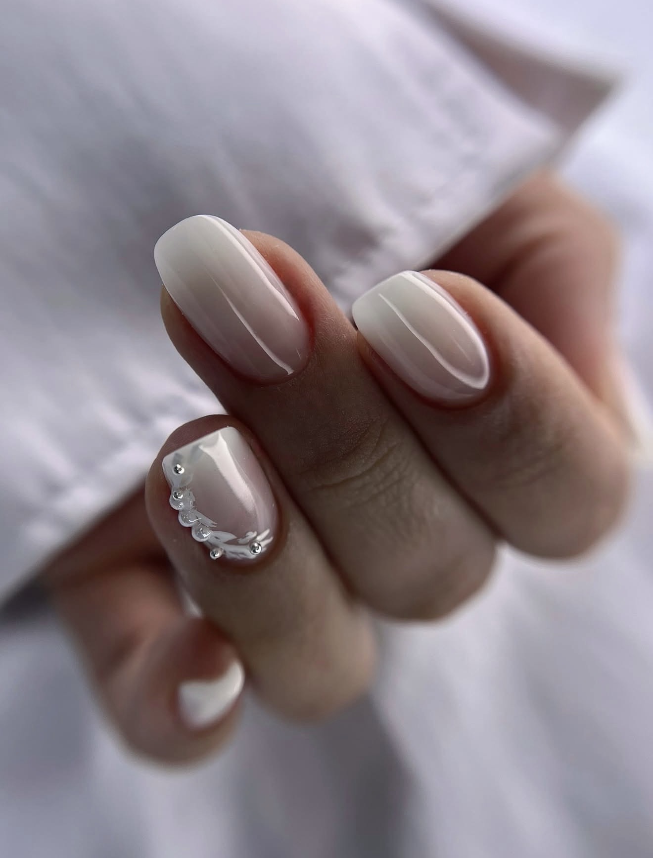 Milky White Ombre Oval Nails with Pearl Accent