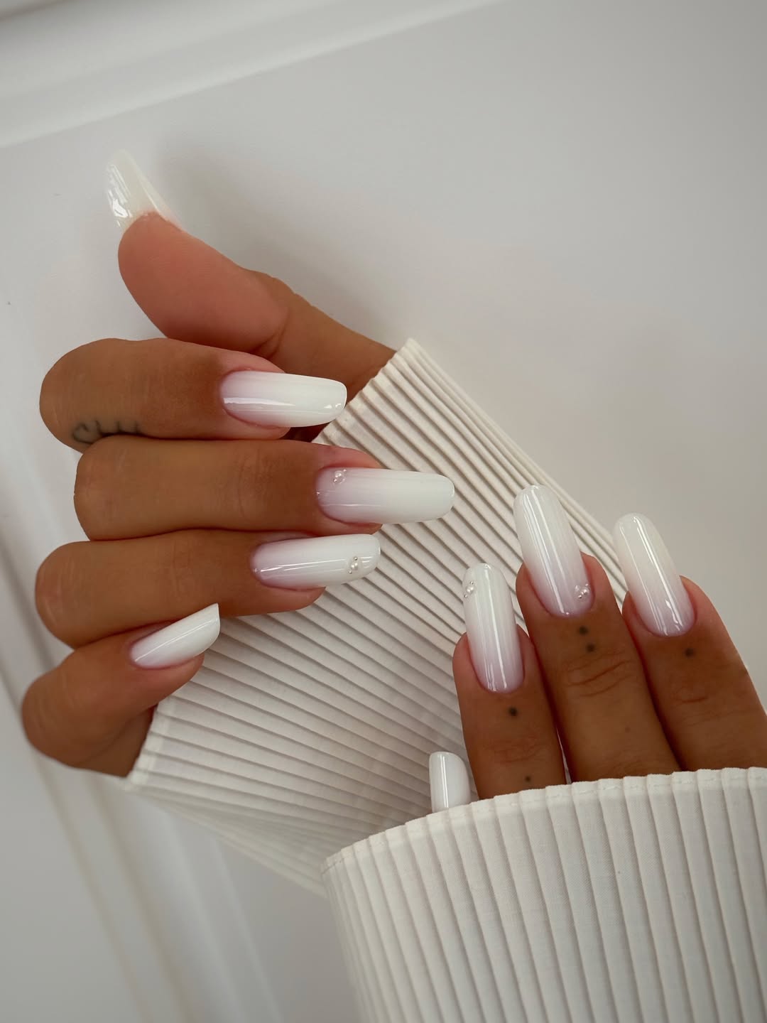 Milky White Ombre Oval Nails With Sparkly Accents