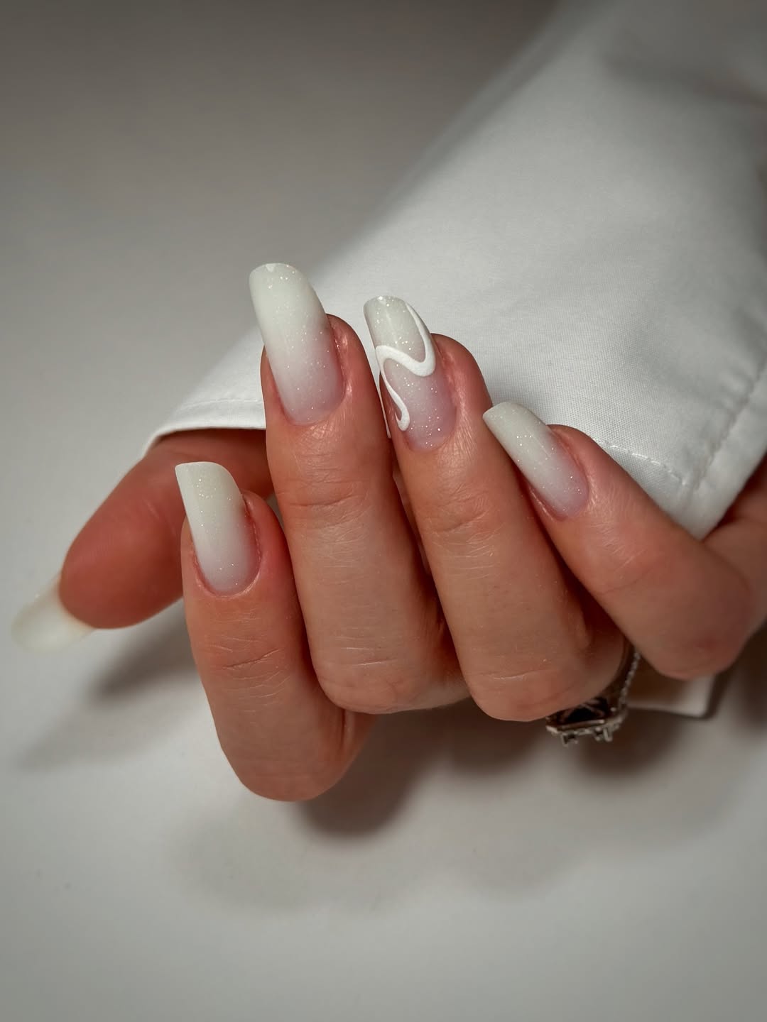 Milky White Ombre Swirl Art Nails