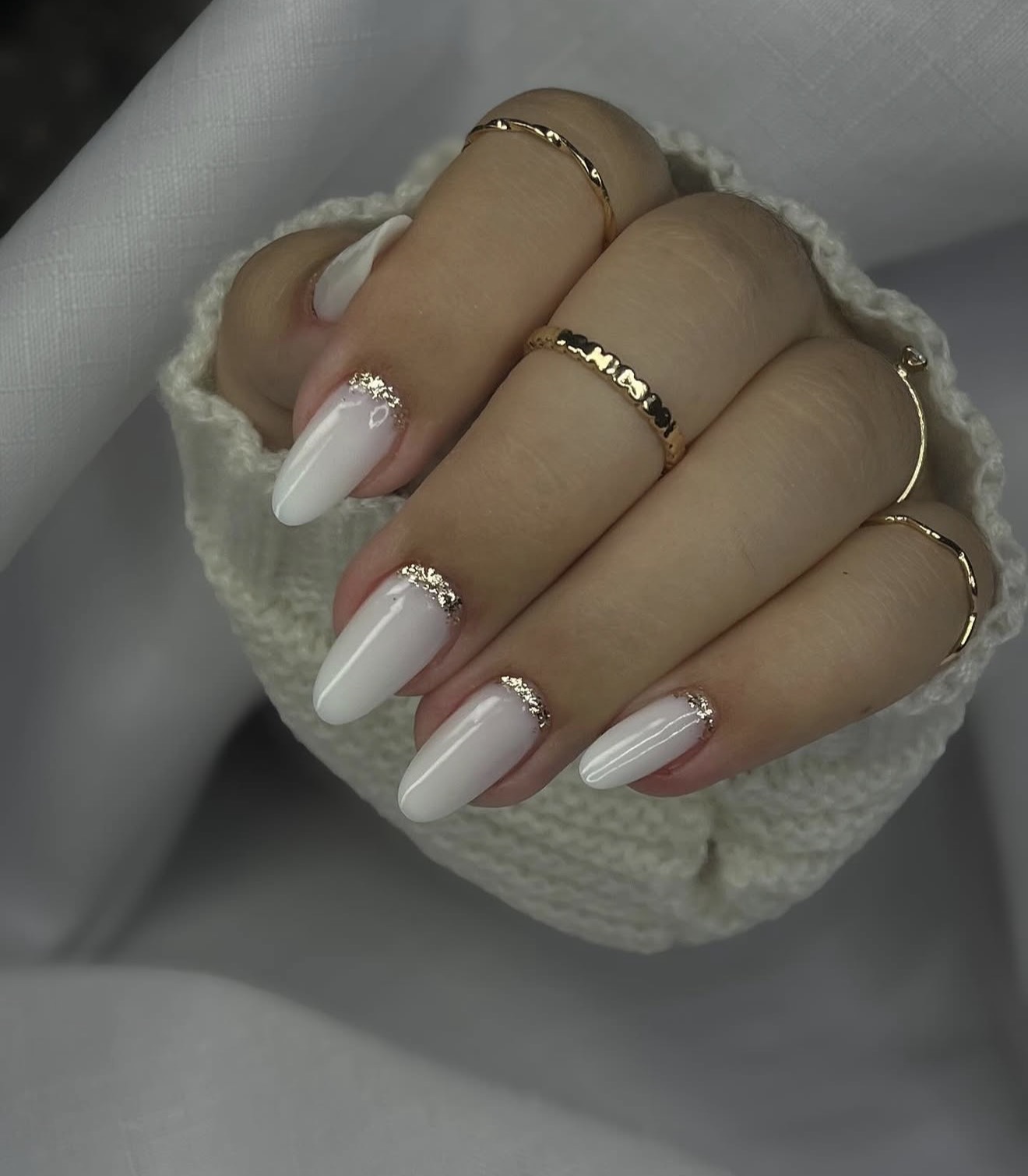 Milky White Oval Nails with Gold Glitter Accent