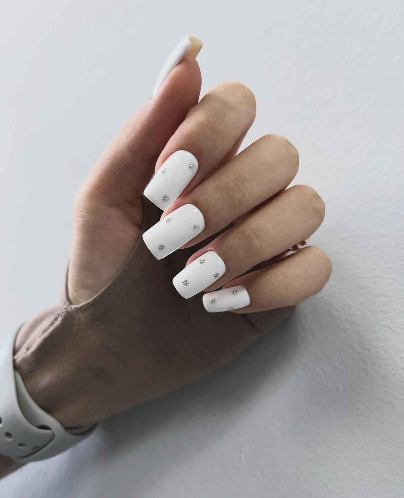 Modern White Square Nails with Silver Stud Accents
