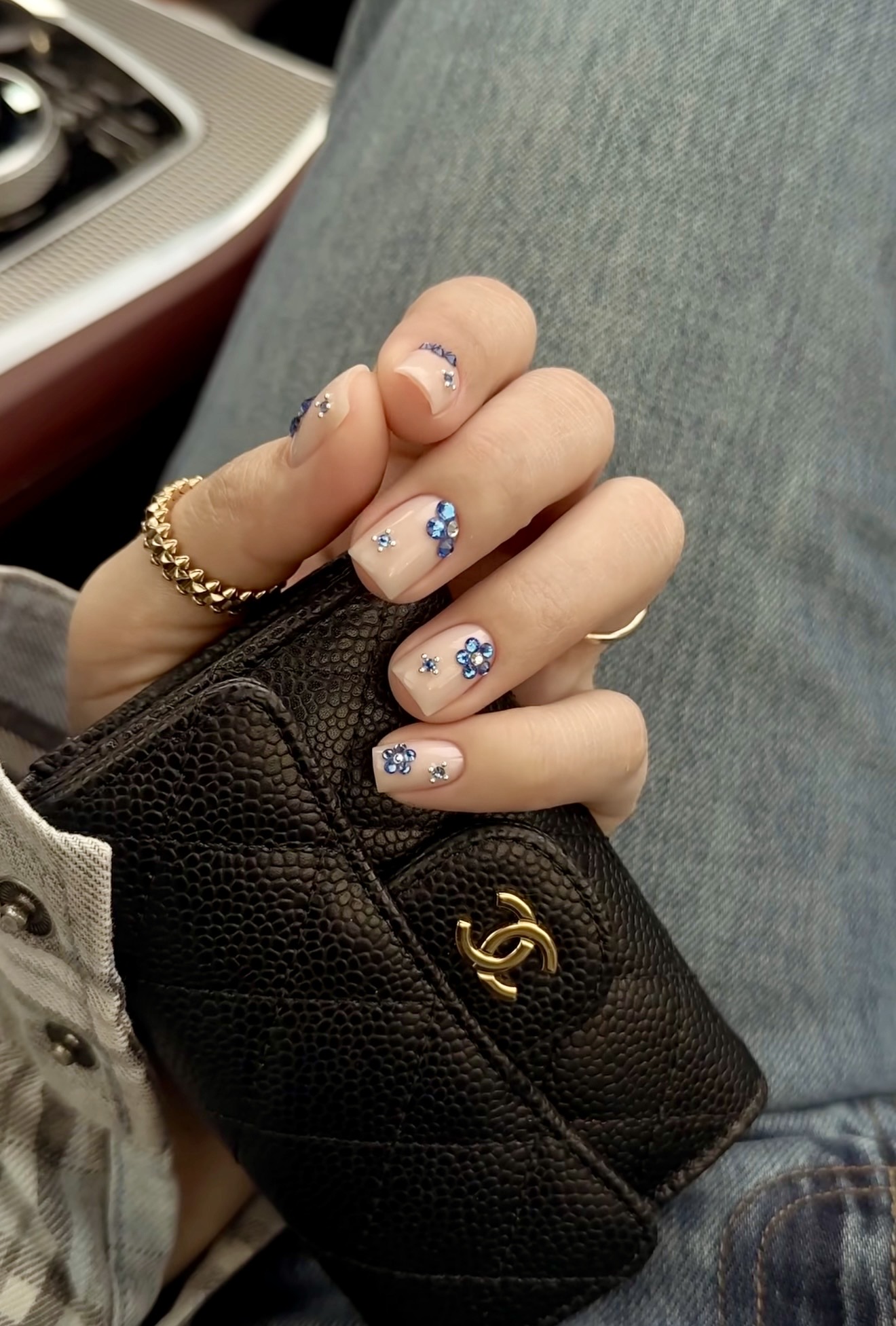 Nude Nails With Blue Rhinestone Flower Accents