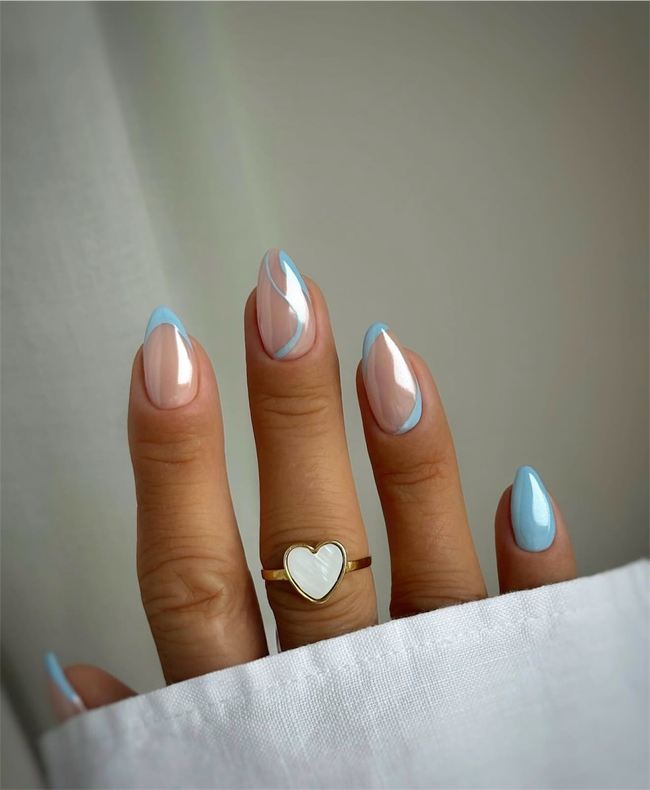 Pale Blue Chrome French Swirl Almond Nails