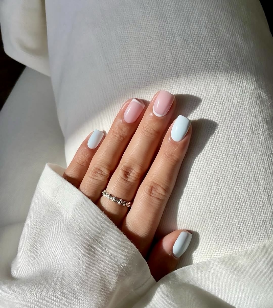 Pastel French Tips with Baby Blue Accents