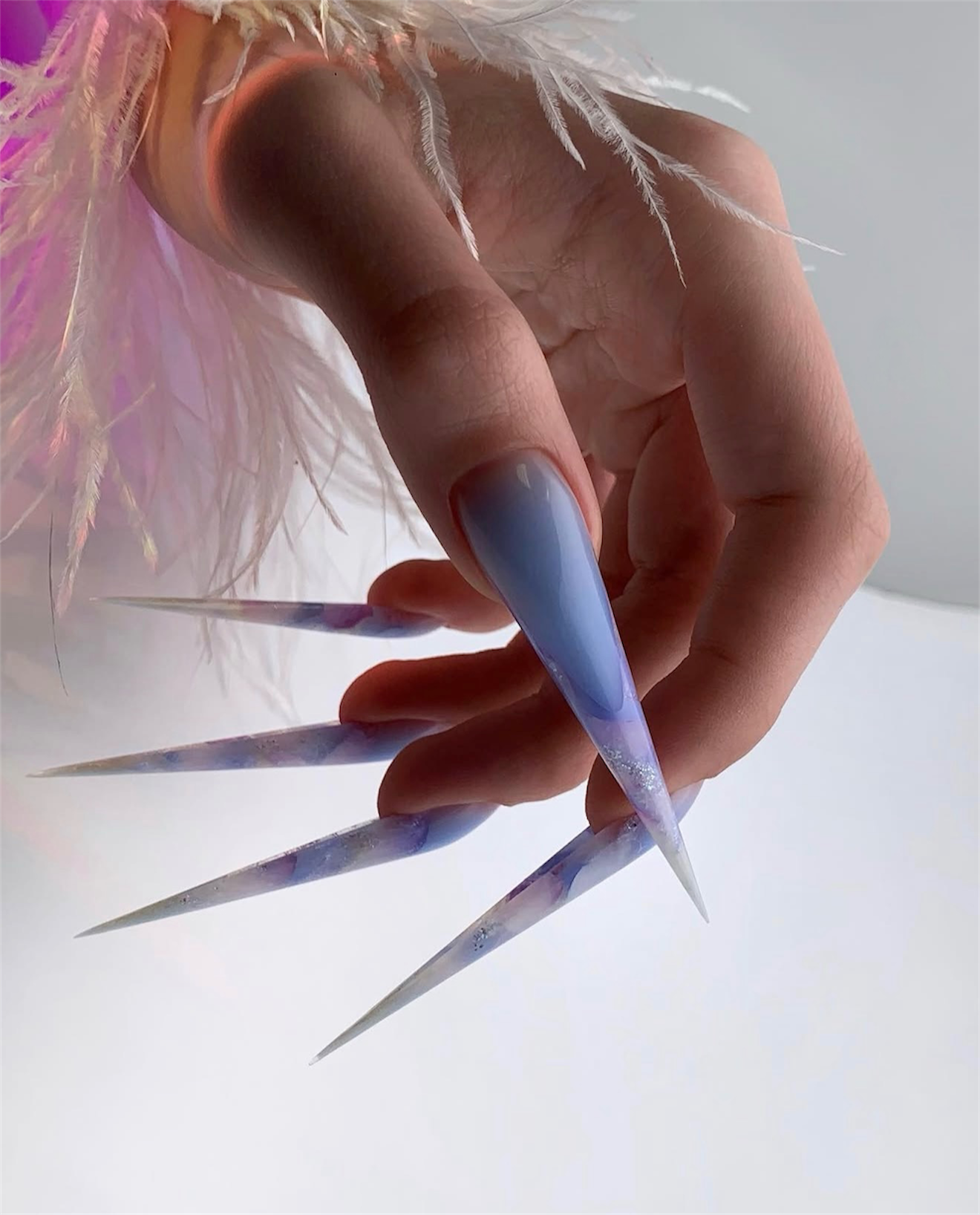 Pastel Marble Stiletto Nails with Glitter Accents