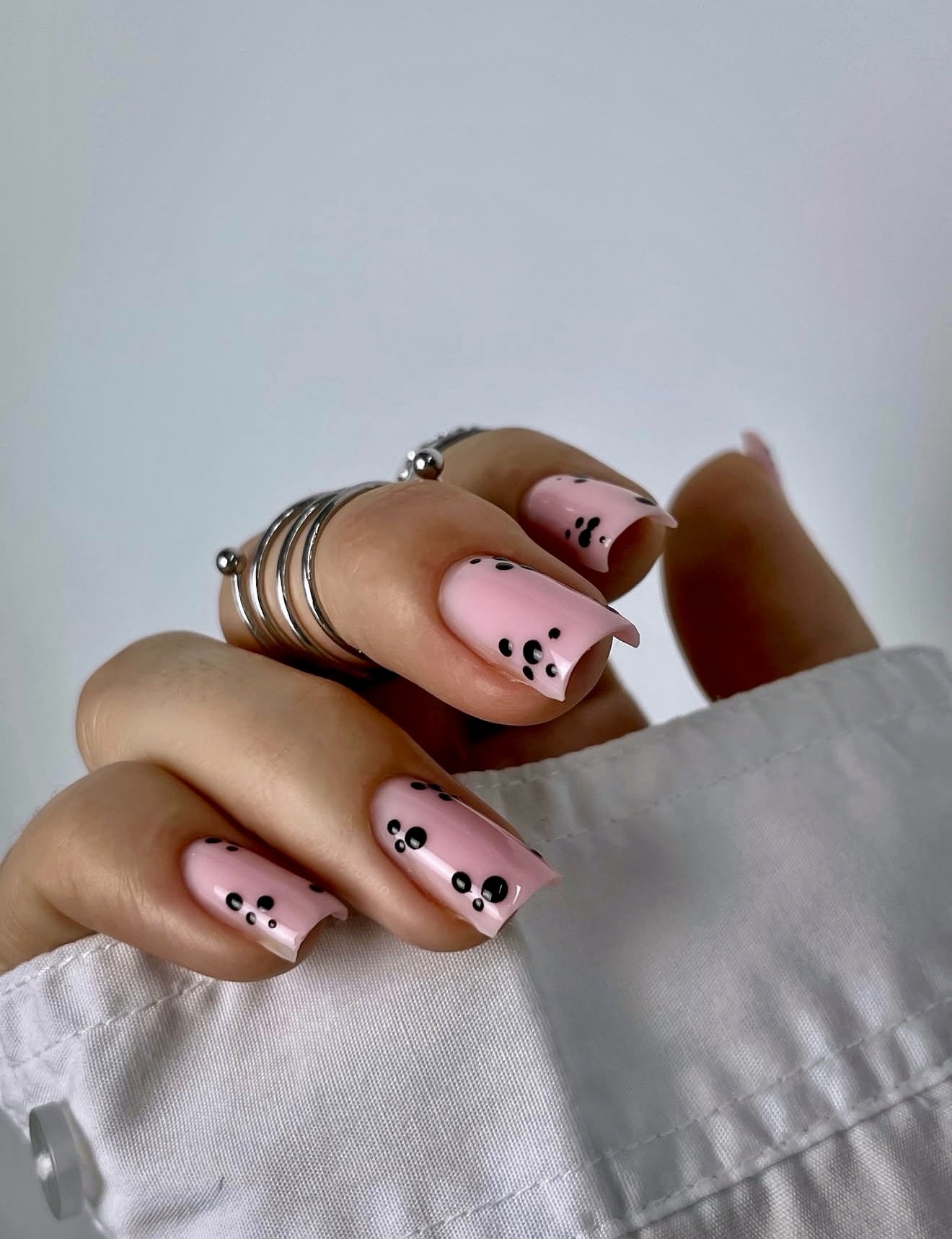 Pastel Pink Nails with Black Dot Accents