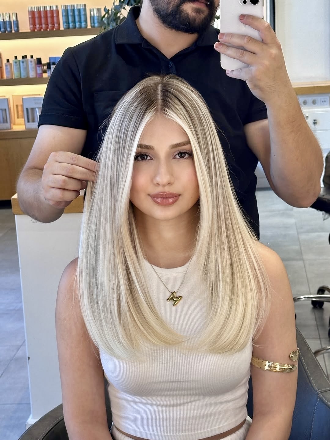 Platinum Blonde Layers With Face Framing Highlights