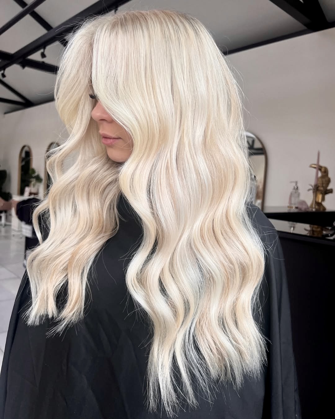 Platinum Blonde Loose Waves With Volume Bangs