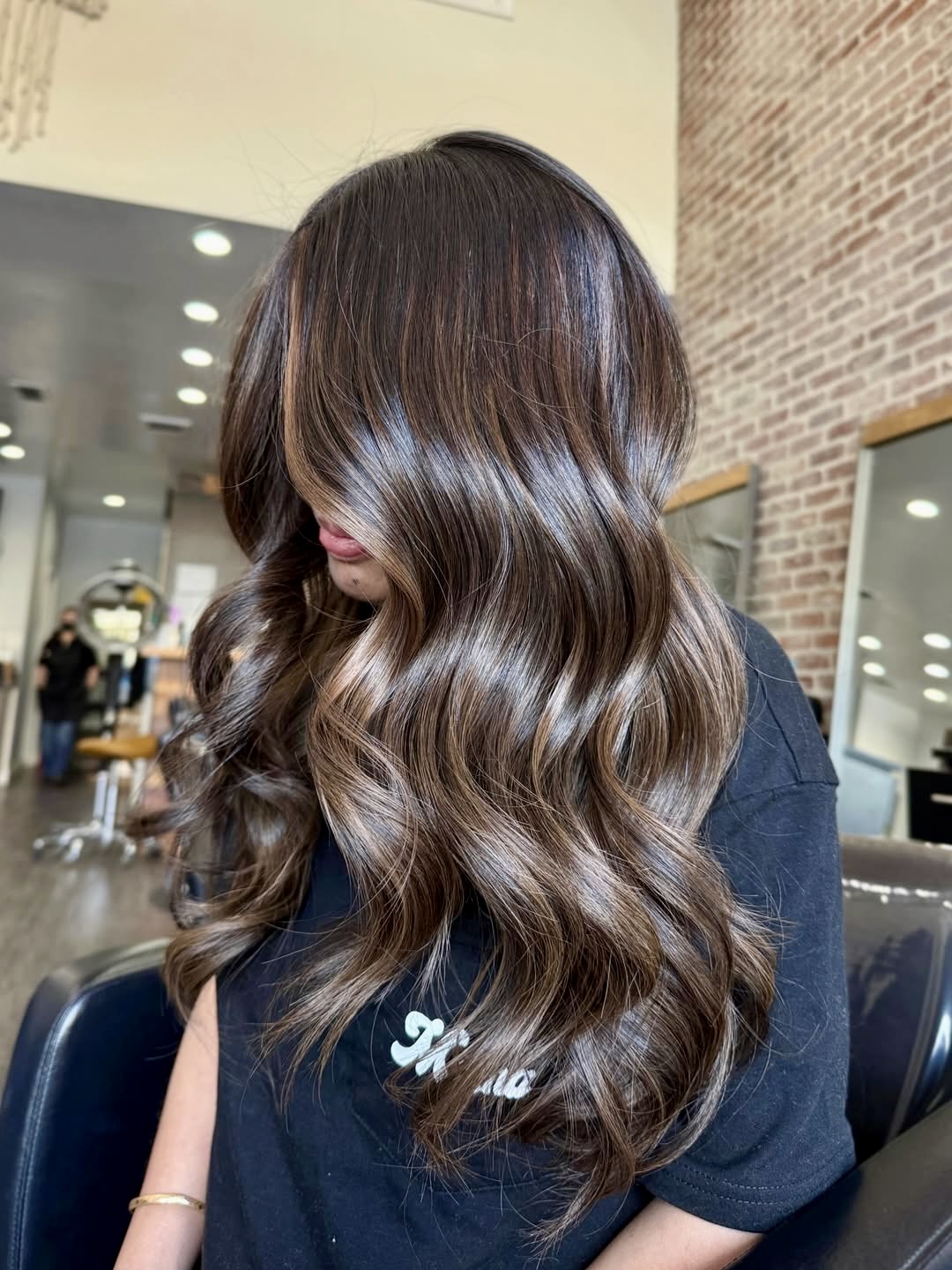 Rich Brunette With Warm Balayage Waves