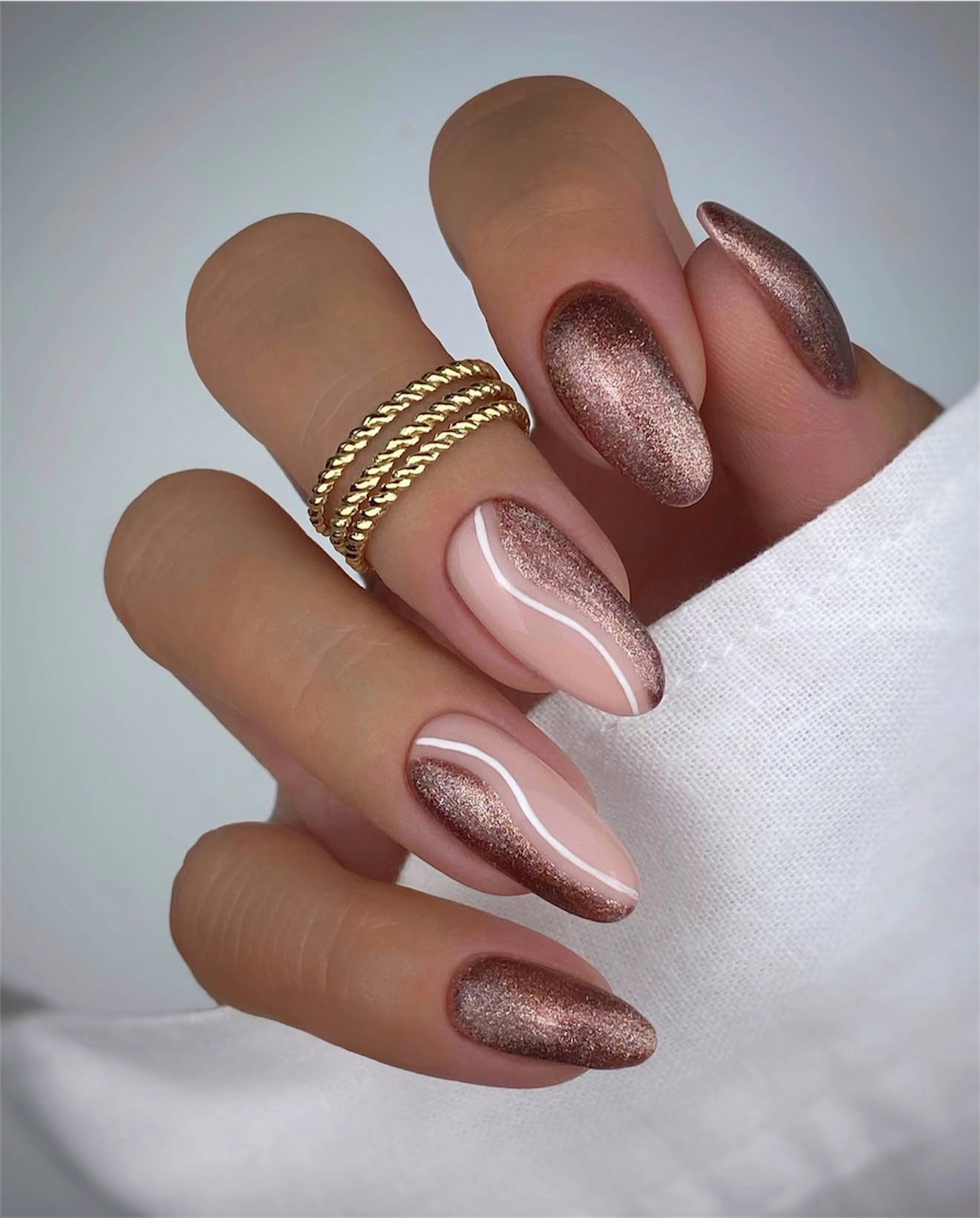 Rose Gold Glitter Cat Eye Swirl Nails