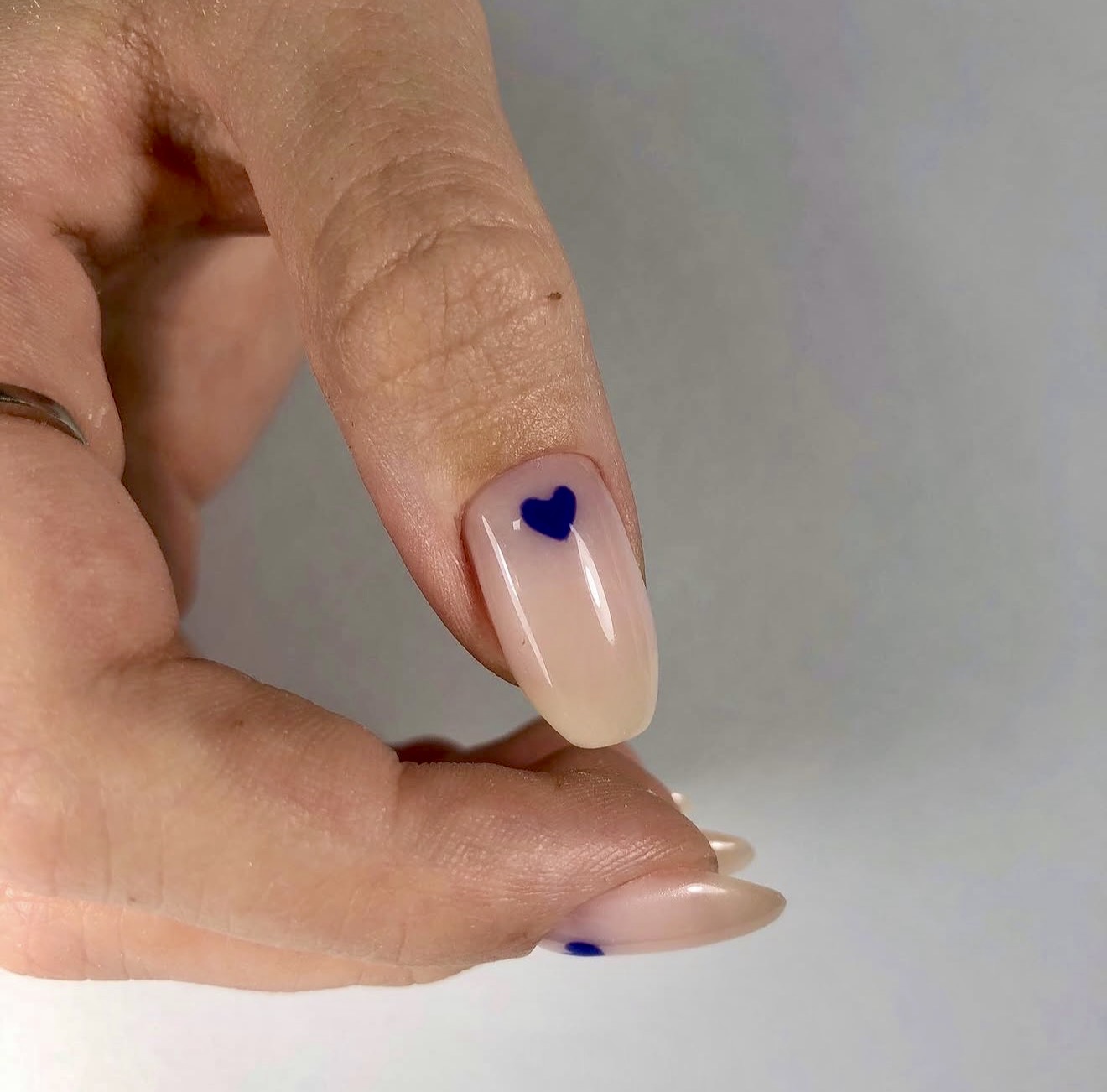 Sheer Milky Base with Deep Blue Heart Accents