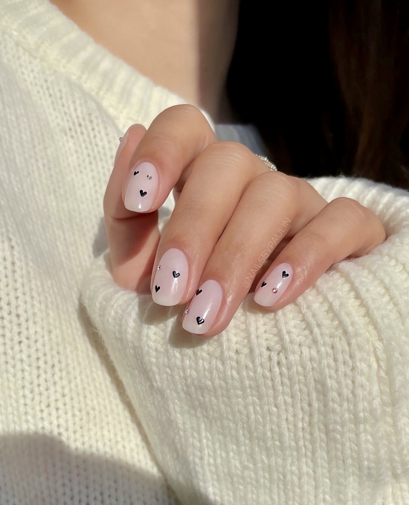 Sheer Milky White Nails with Black Hearts and Gems