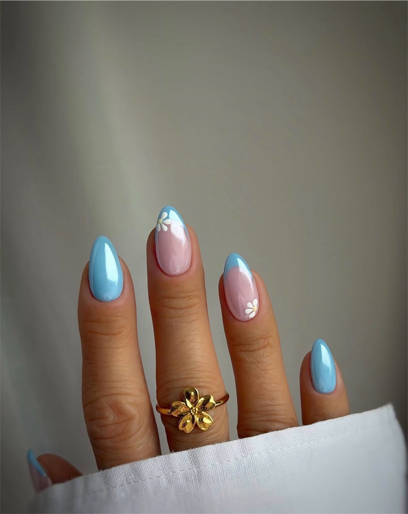 Shimmering Pastel French Tips with Daisy Accents