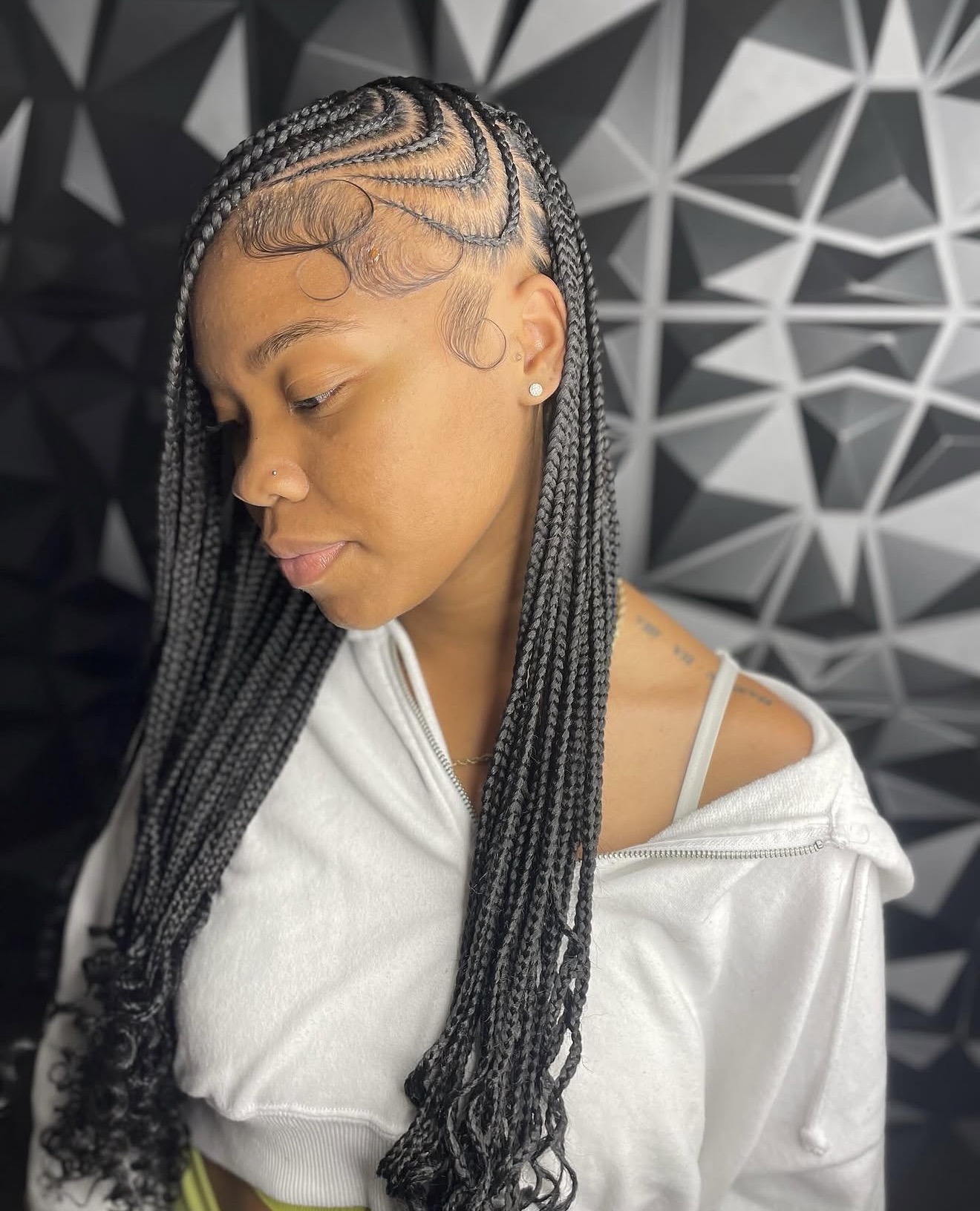 Side-Swept Braids With Defined Edges and Curls