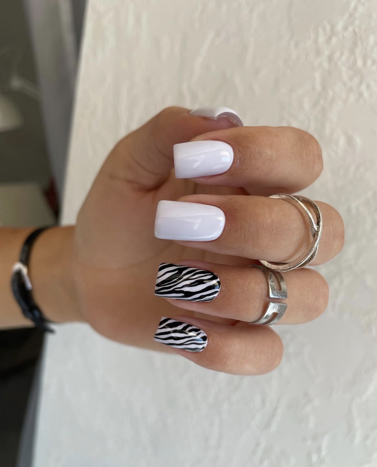 Sleek White Square Nails with Bold Zebra Print