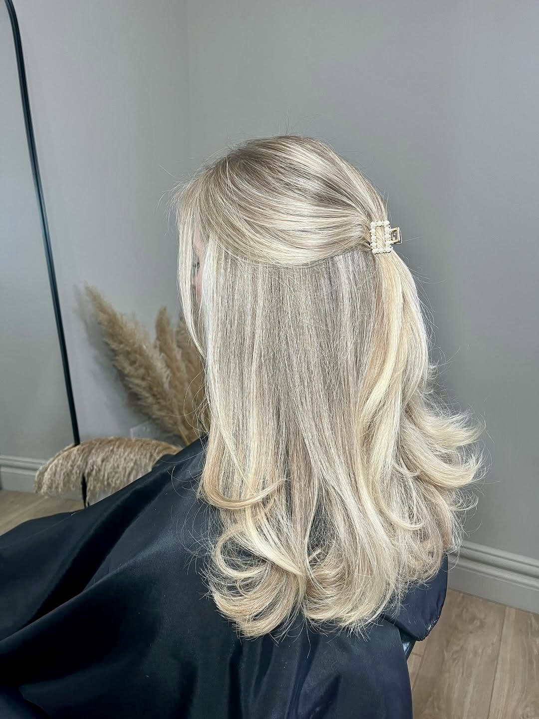 Soft Blonde Waves With Pearl Claw Clip