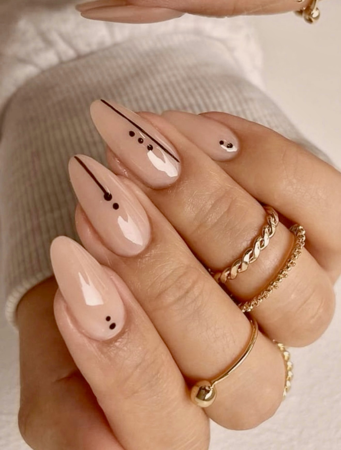 Subtle Black Line and Dot Almond Nails