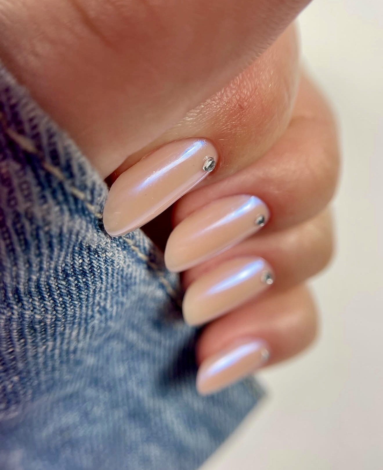 Subtle Shimmer Almond Nails with Rhinestone Accents