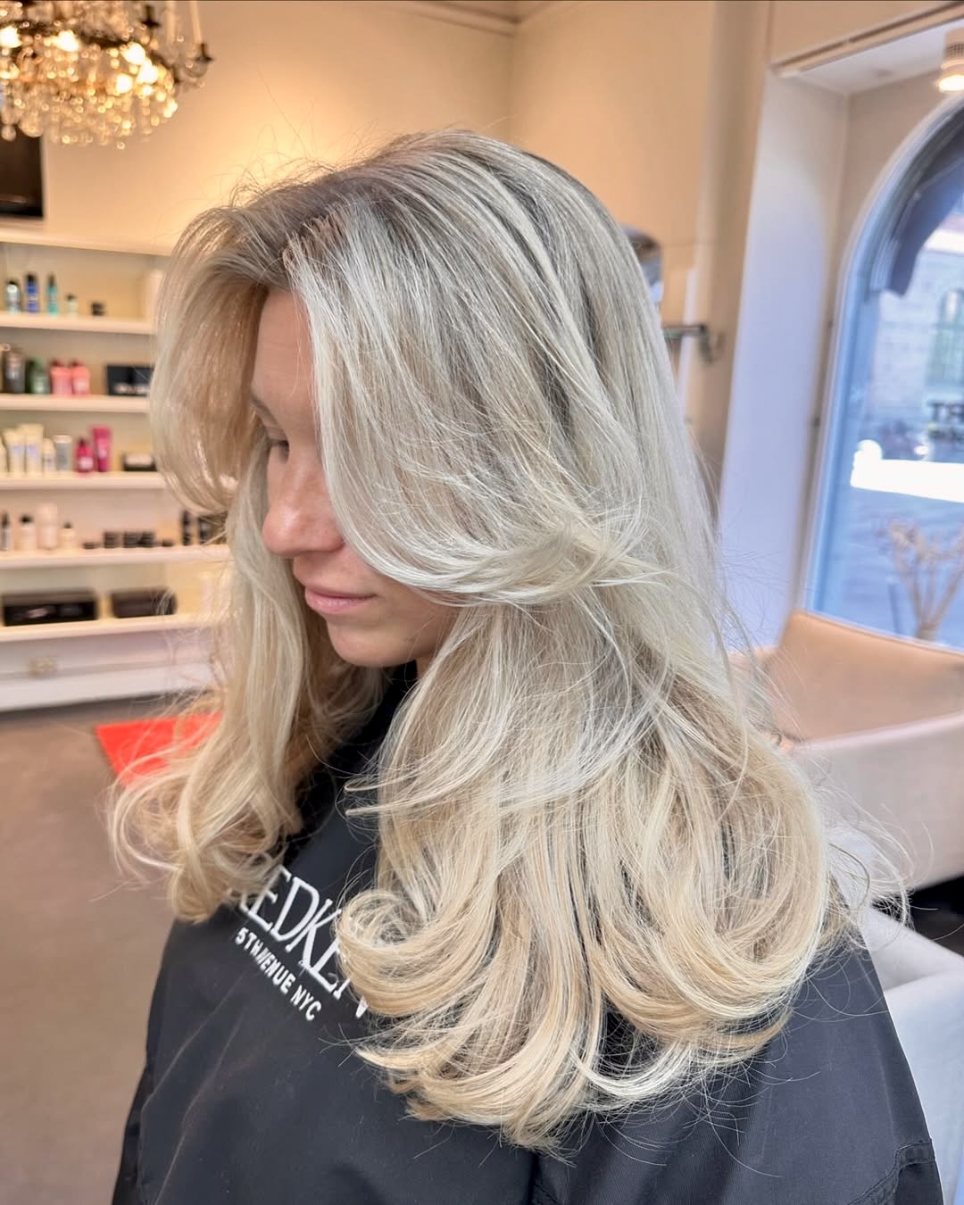 Sun-Kissed Platinum Blonde Layers With Curtain Bangs