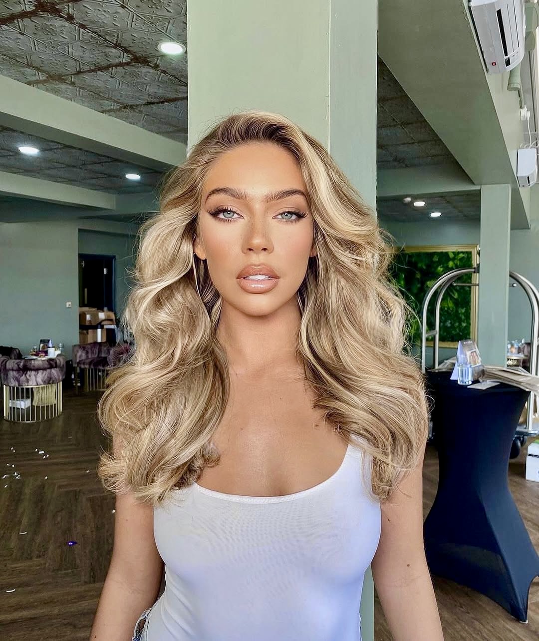 Voluminous Honey Blonde Waves With Face Framing Layers