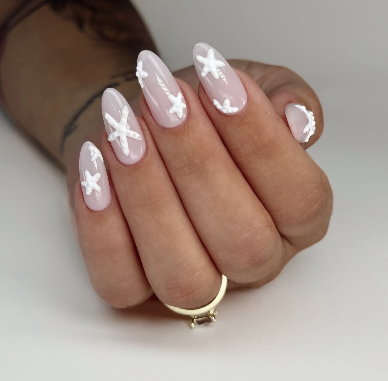 3D White Starburst Milky Almond Nails
