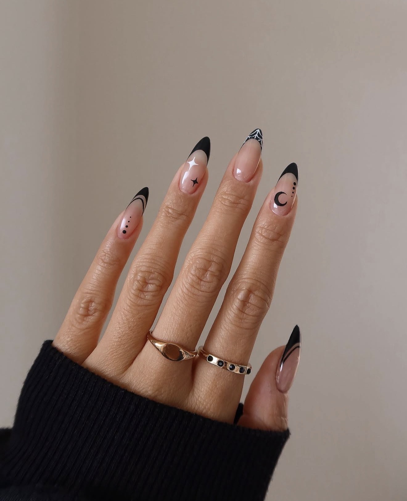 Black French Tip Almond Nails with Celestial Art