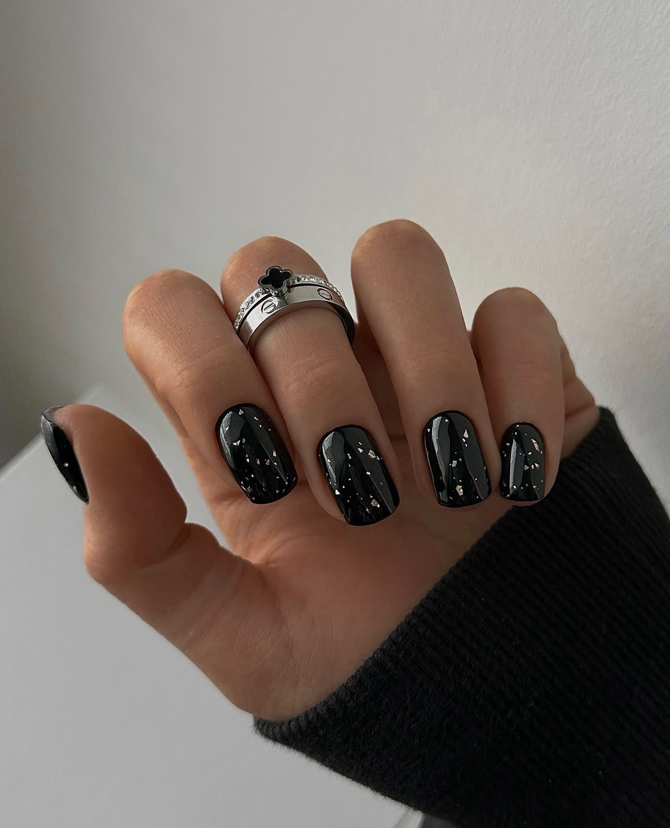 Black Glossy Nails with Scattered Silver Flakes