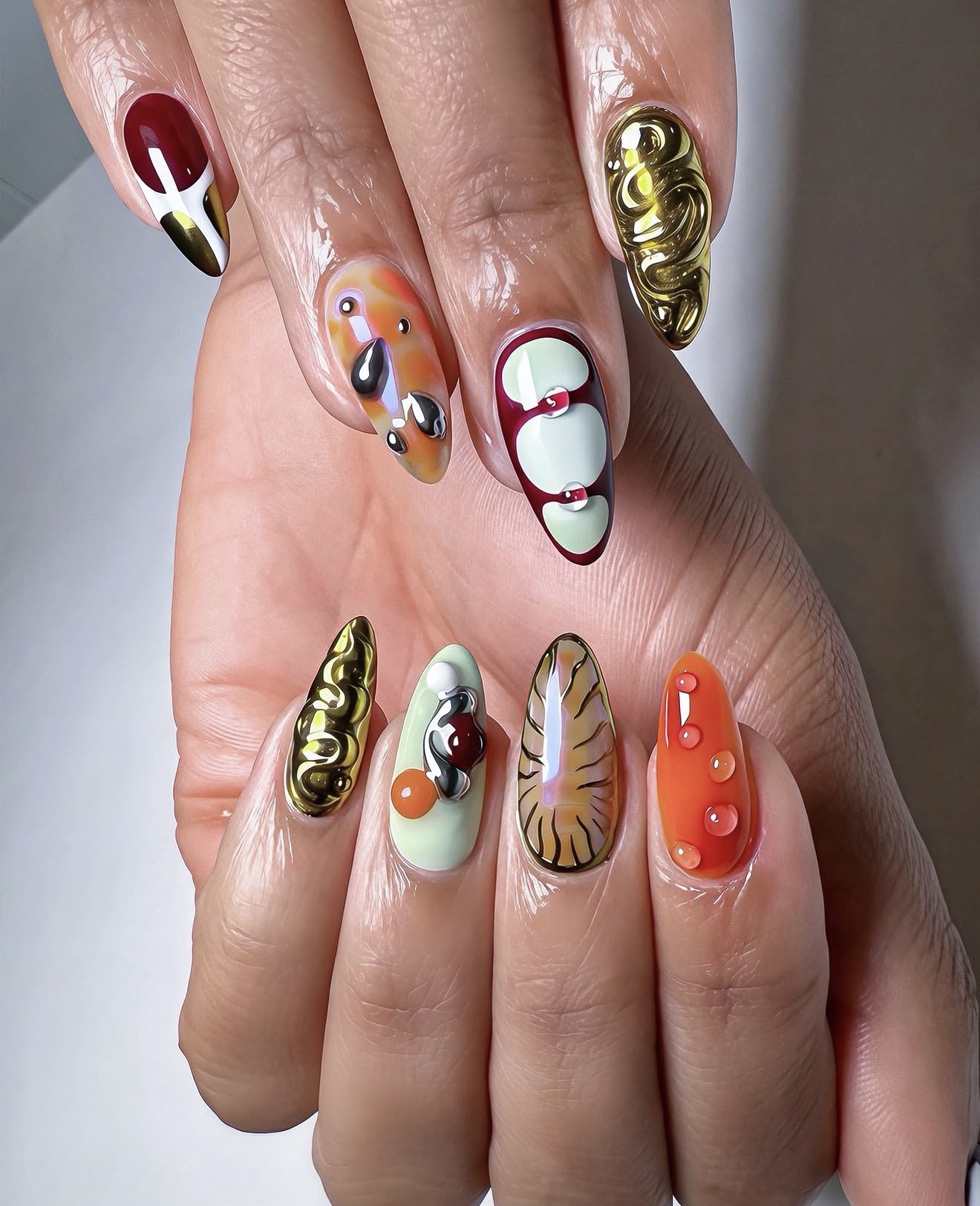 Bold 3D Sculpted Gold & Abstract Character Nails