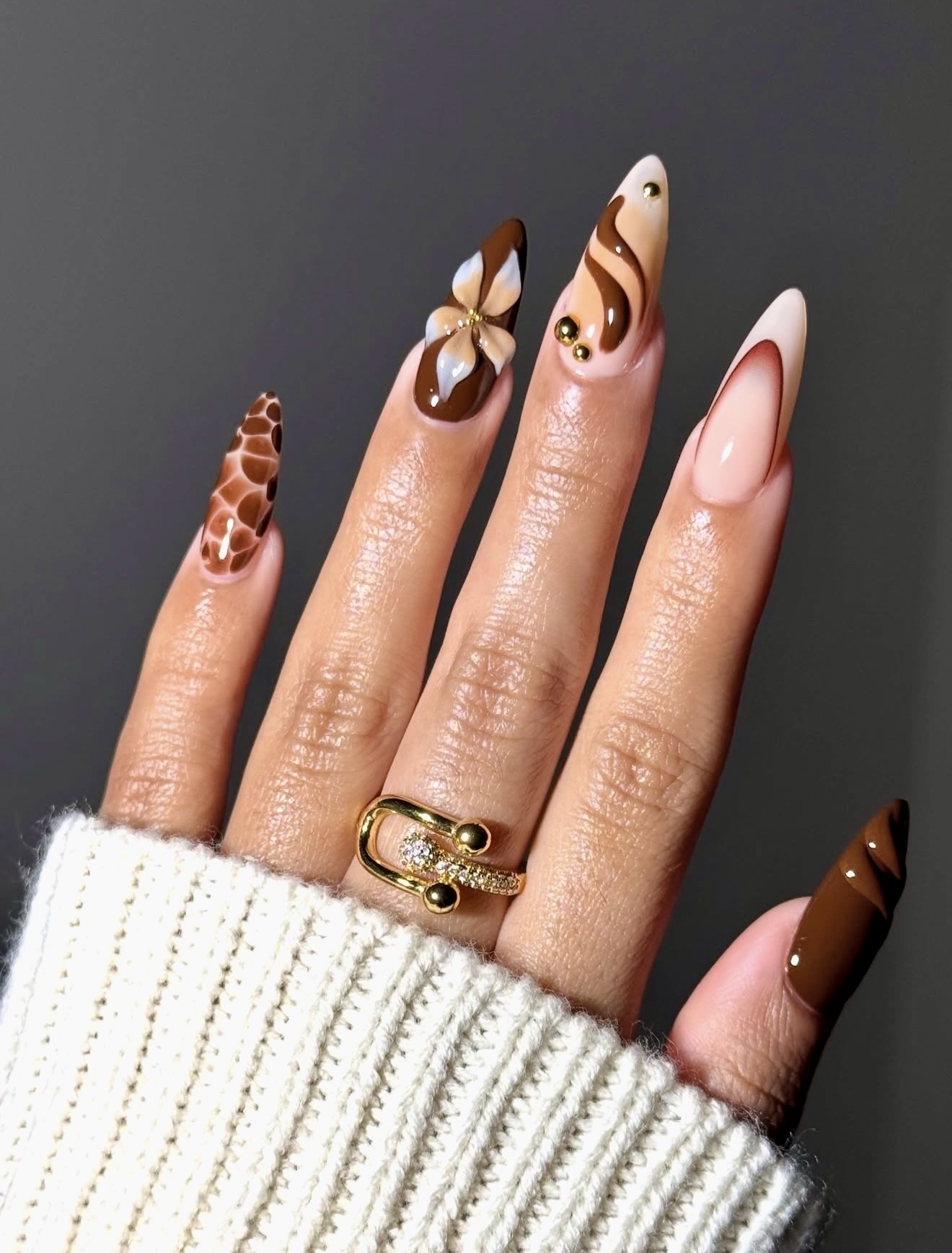 Brown Swirl French Tip Almond Nails
