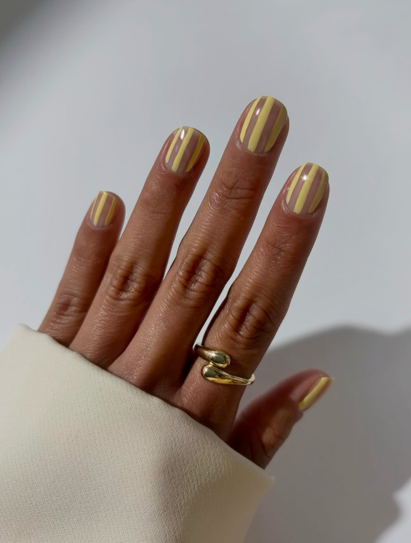 Butter Yellow and Nude Striped Glossy Nails