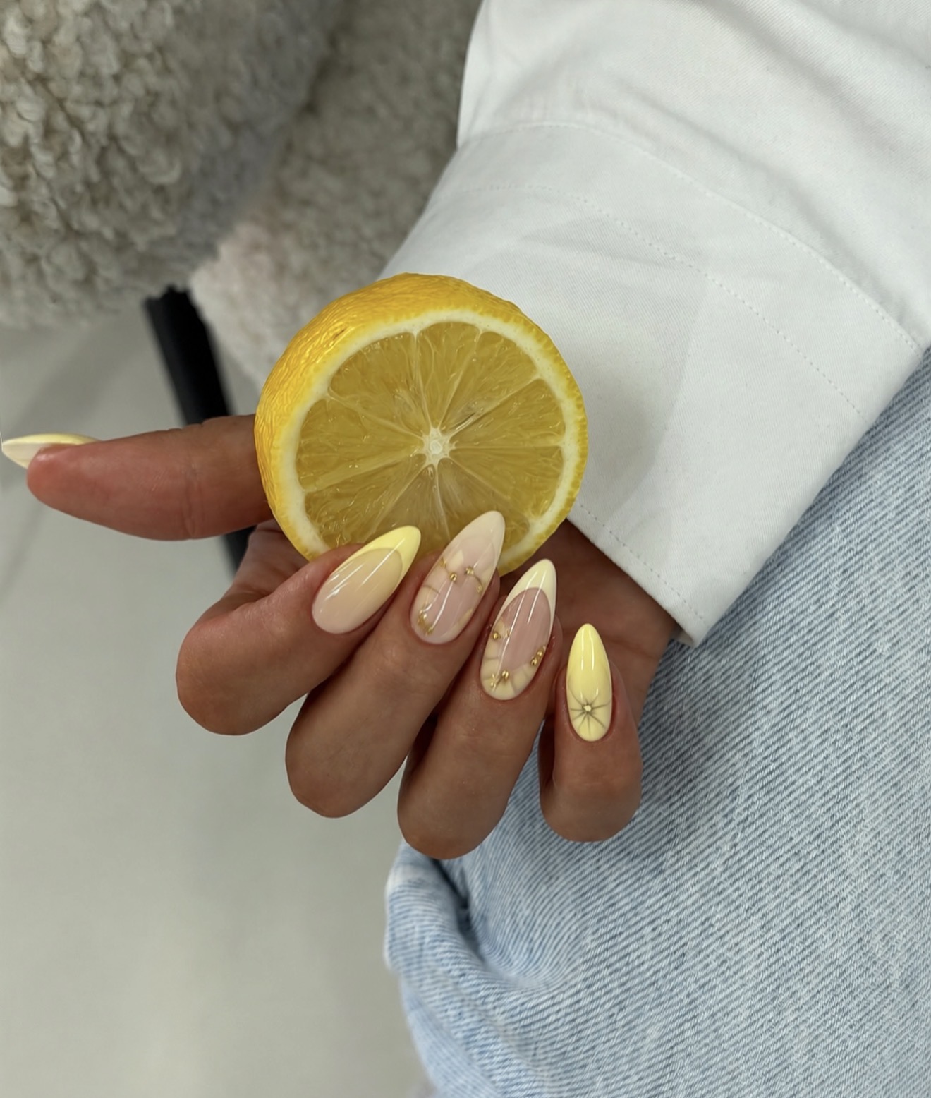 Butter Yellow French Tip Almond Nails with Gold Accents