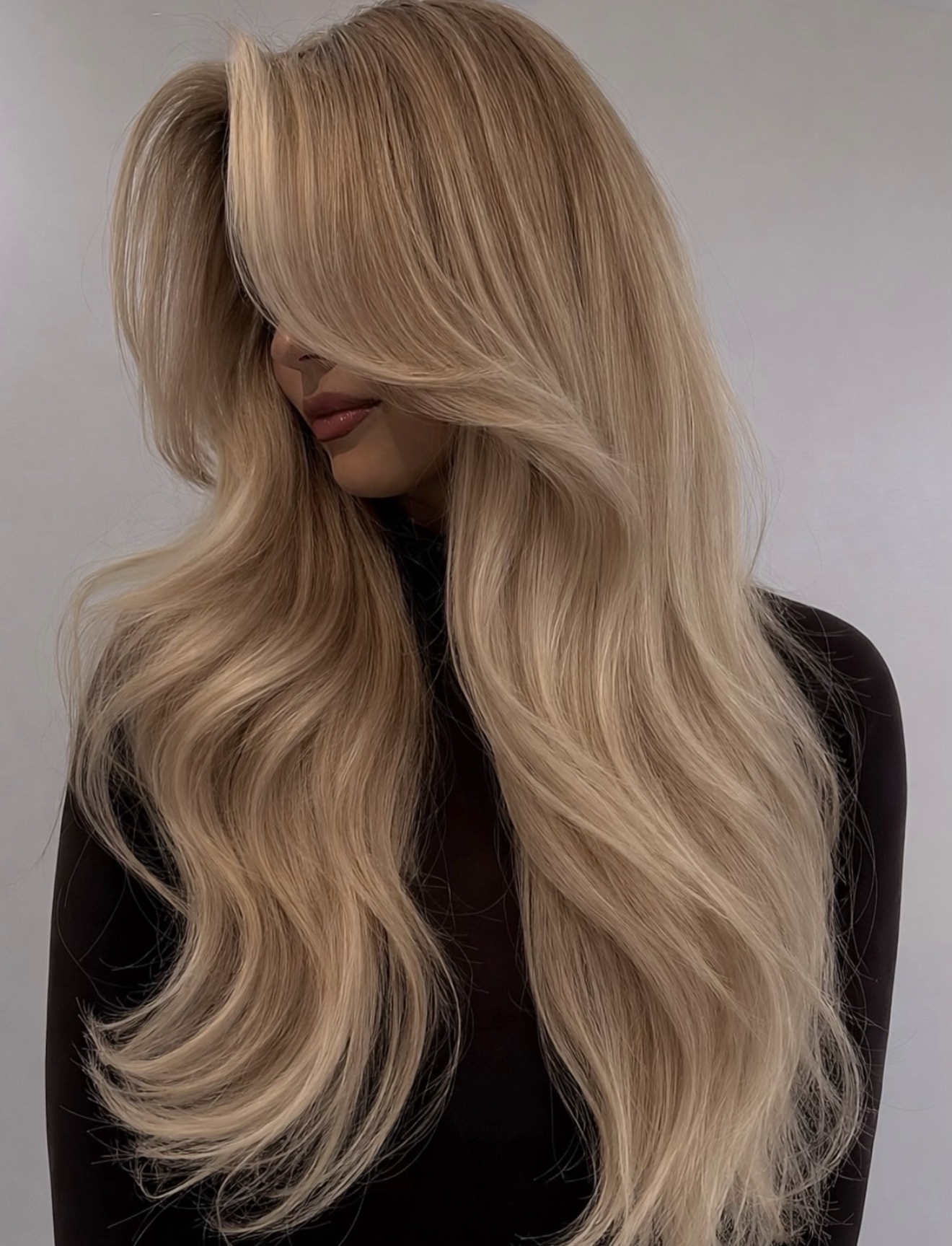 Champagne Blonde Waves With Face-Framing Layers