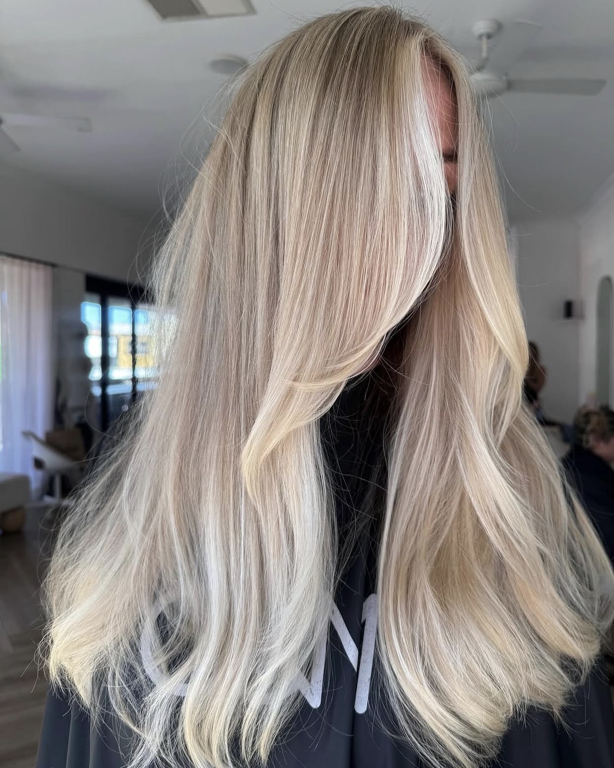 Champagne Blonde Waves With Face-Framing Layers