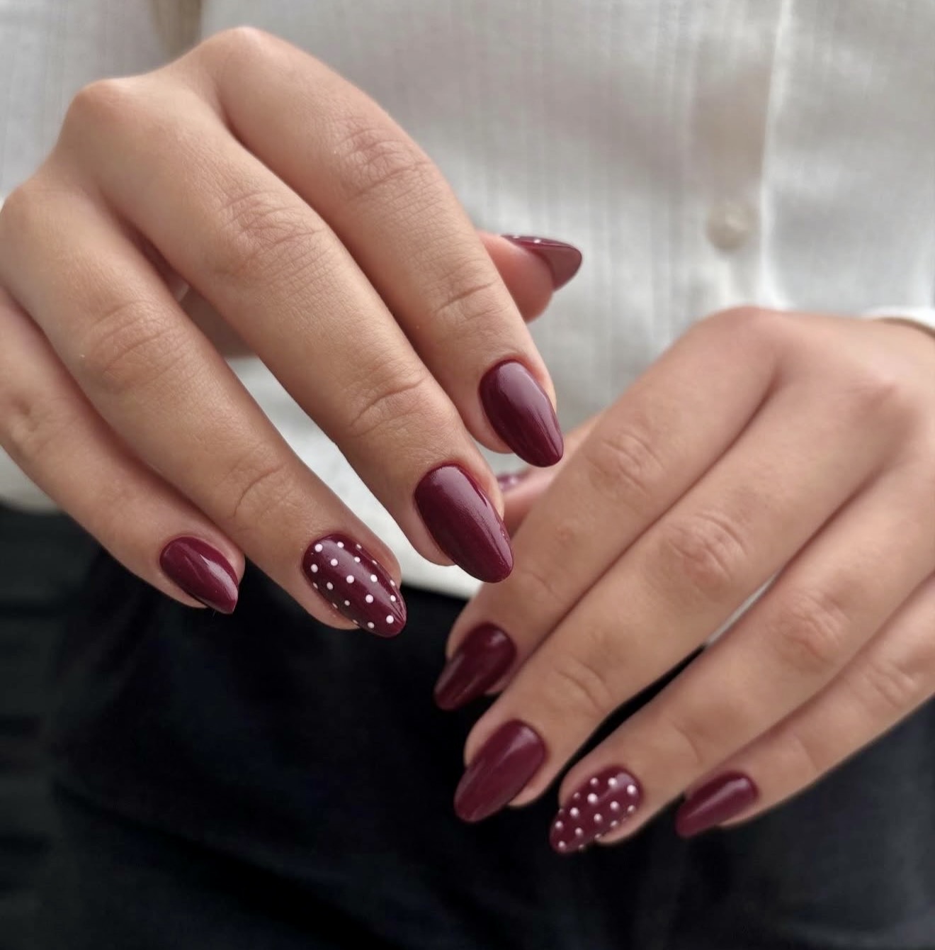 Chic Burgundy Almond Nails with White Polka Dots