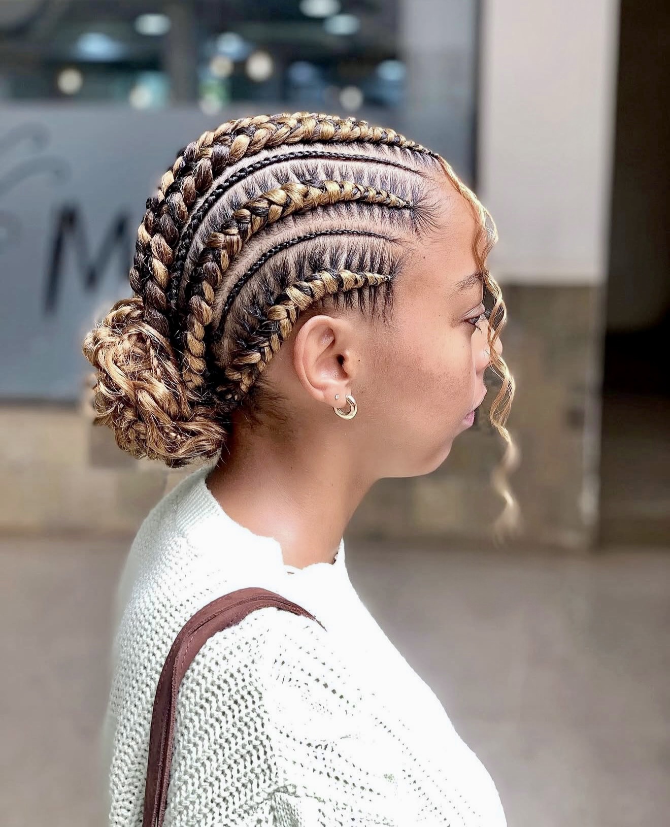 Chic Cornrows With Blonde Highlights Into A Low Bun